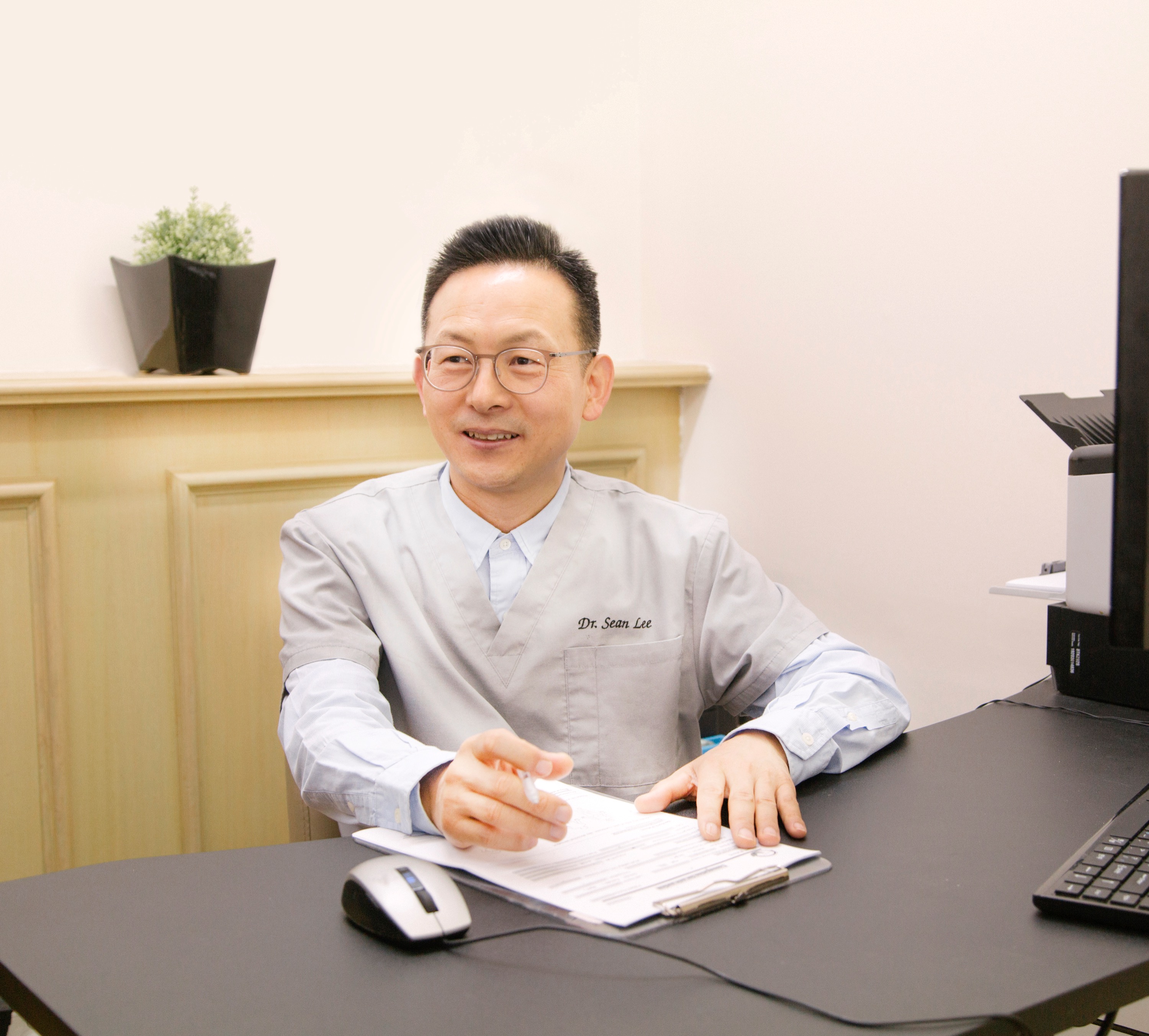 Dr Sean Lee in a clinic consultation room
